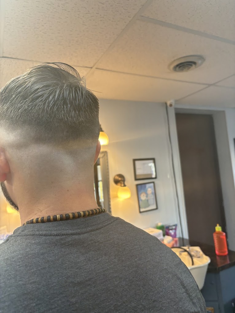 Clean taper fade from behind - Grandville Barbershop