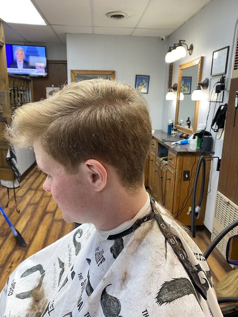 Flat top haircut in warm shop interior - Grandville Barbershop